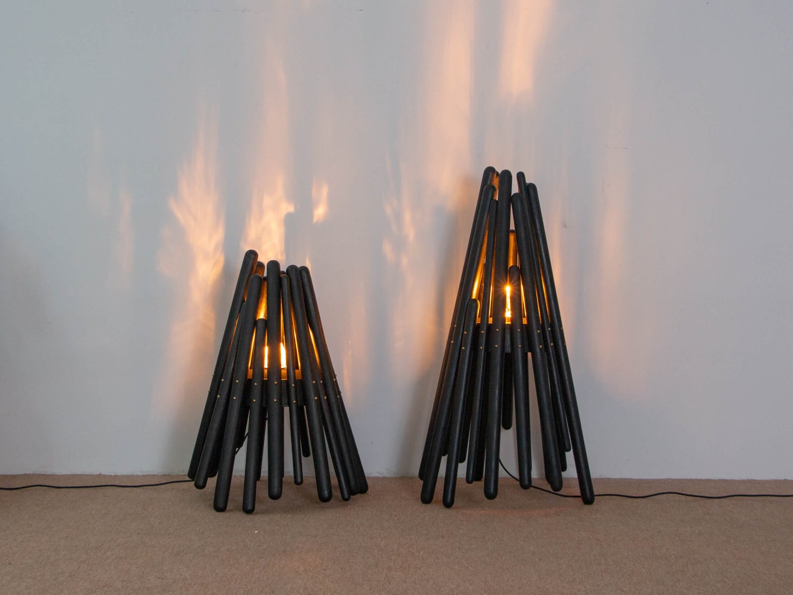 This is a white background picture showing product details of two artistic floor lamps. Made from natural solid wood and handmade, these lamps feature a unique design reminiscent of European and American medieval style, perfect for home decoration. The product is named Blaze and is from FLOWLIGHT DESIGN INC. / flowlightdesign.com.